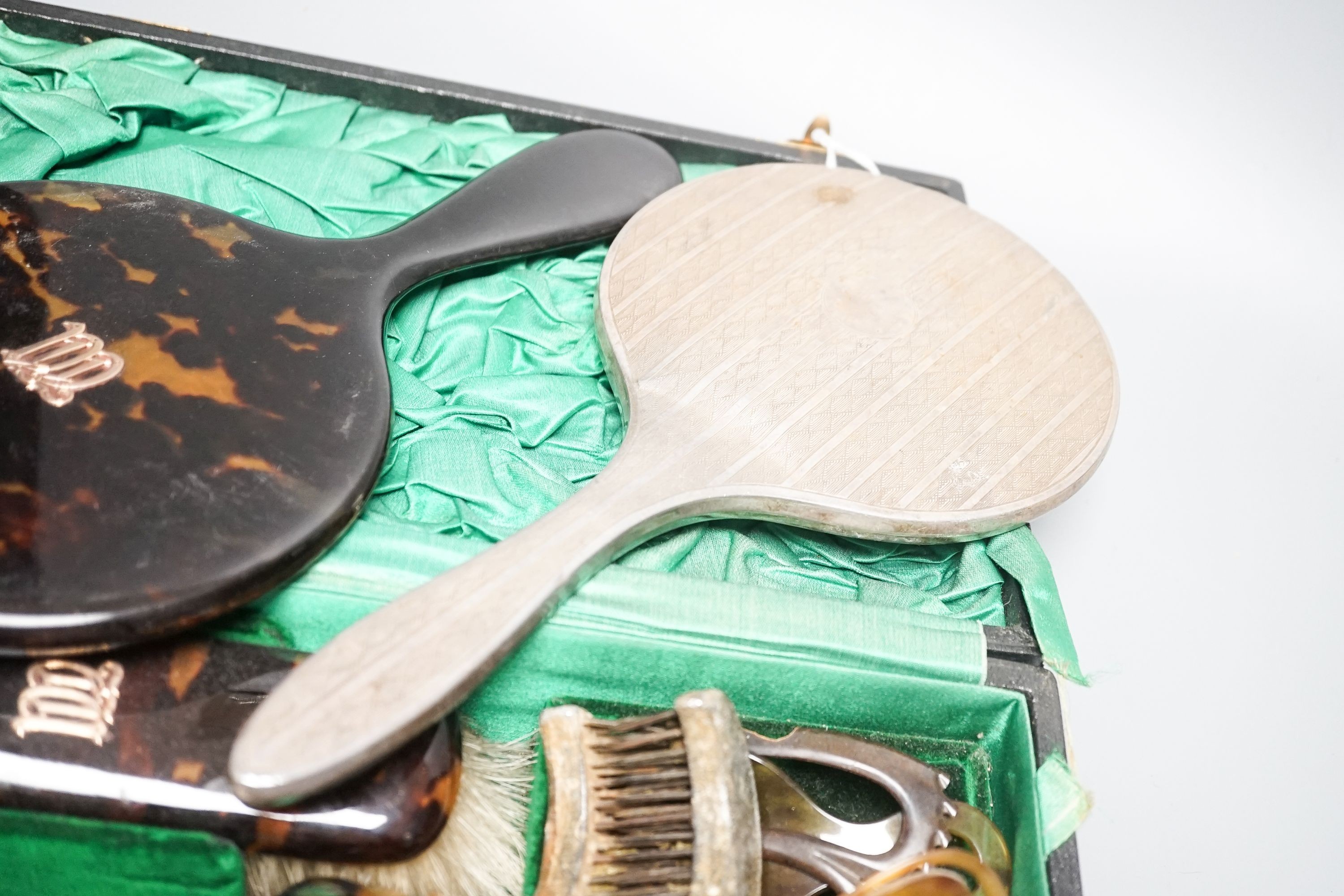 A tortoiseshell toilet set and silver dressing table items